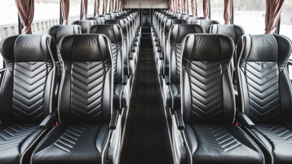 54 passenger charter bus inside boulder